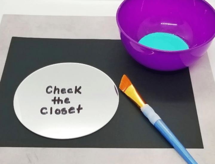 escape room game shows a mirror with check the closet printed on it