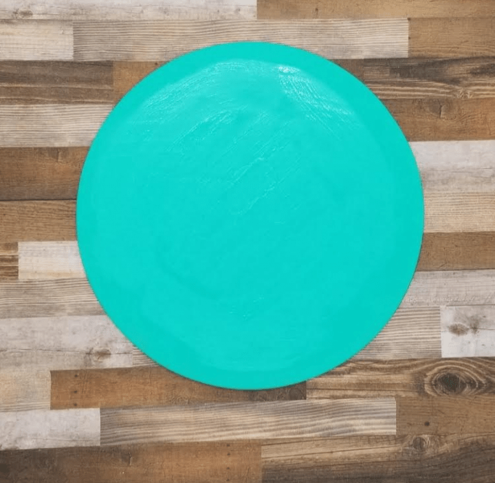 escape game shows a blue circle shape on a wooden background