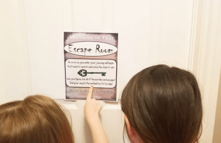 diy escape room shows two children looking at a welcome letter