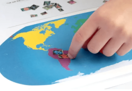 stem shows a child placing a flower cut out on a map