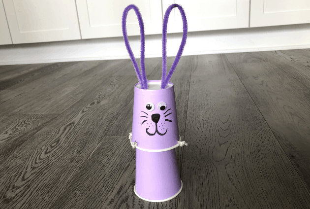 spring STEM activity for kids shows a purple bunny made from cups.