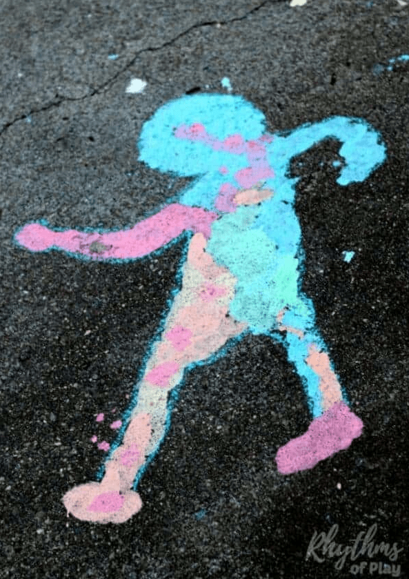 spring art activity shows the outline of a child in colorful chalk