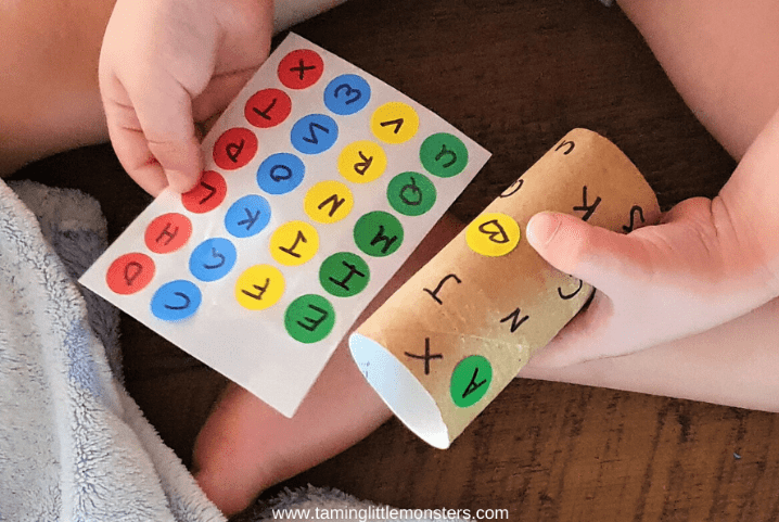 phonemic activities shows a child matching letters with stickers
