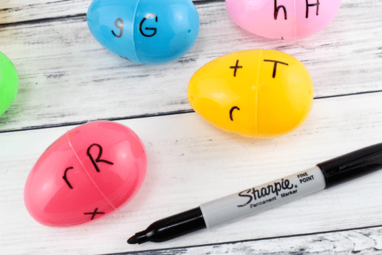 phonological awareness shows easter eggs with letters on them and a marker.