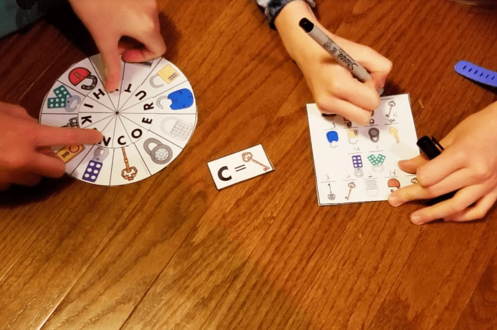 free printable escape room shows a child solving a wheel code.