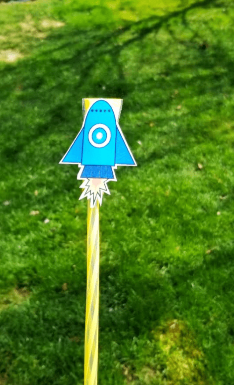 straw rocket STEM challenge shows a printable rocket cut out on a straw.