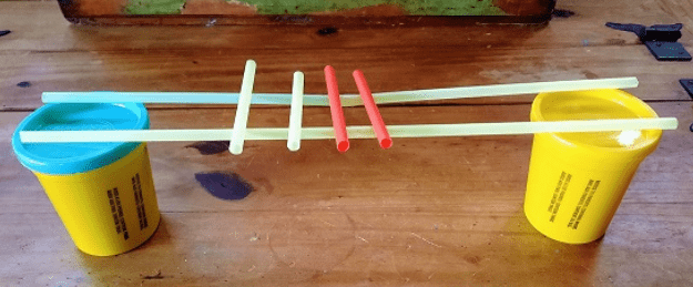 bridge building stem challenge shows a bridge made from straws
