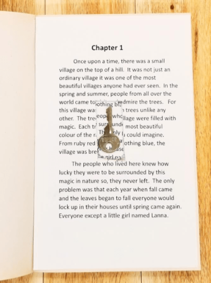 escape room for kids shows a book with a key hidden in it.