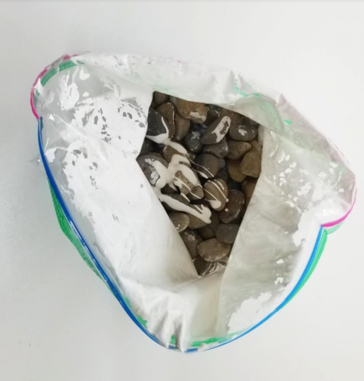 nature art stones in a bag with paint