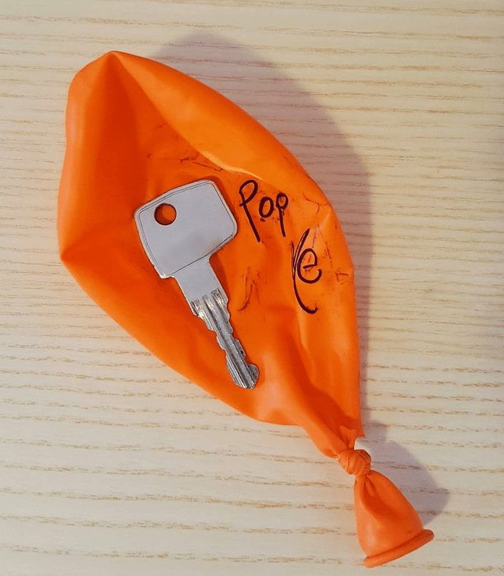 escape room ideas shows a popped balloon with a key on top.