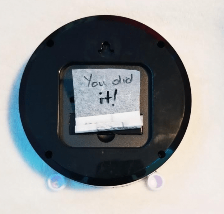 Kids escape room shows the back of a clock with a you did it message