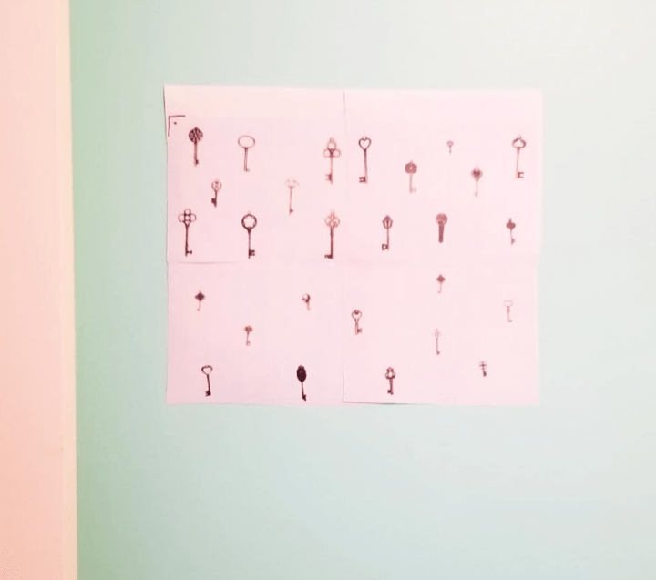 DIY escape room shows the four pages with the keys on the wall