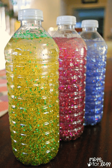 mindfulness activities show three bottles with different colors and sparkles in each
