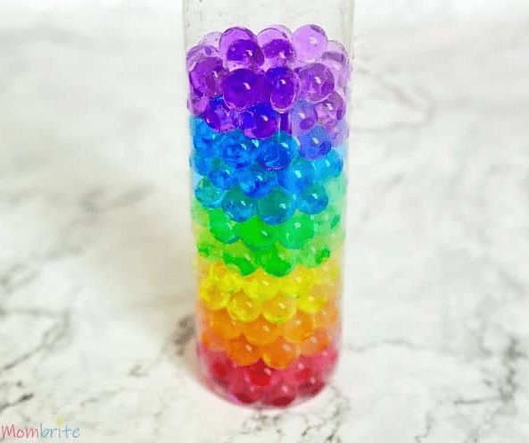 mindfulness activities for kids shows a bottle filled with rainbow water beads