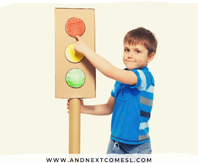 self regulation shows a child holding a DIY traffic light