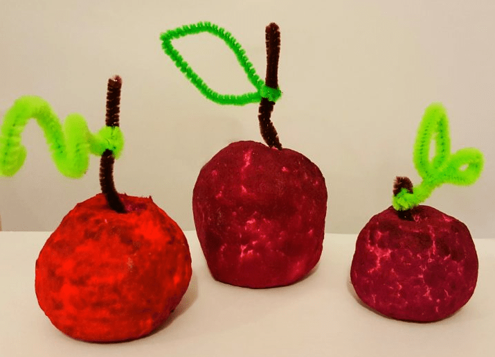 recycled crafts for kids shows three apples.