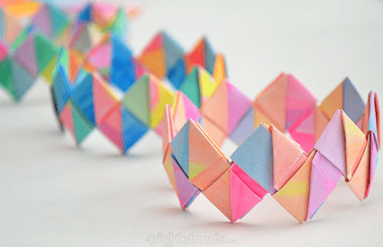 paper crafts and activities shows a folded paper bracelet.