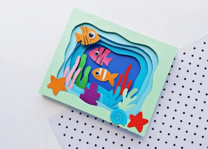 paper crafts and activities shows a 3d fish tank craft.