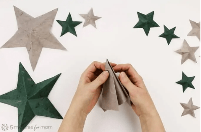 paper crafts and activities shows how to fold paper to make stars.