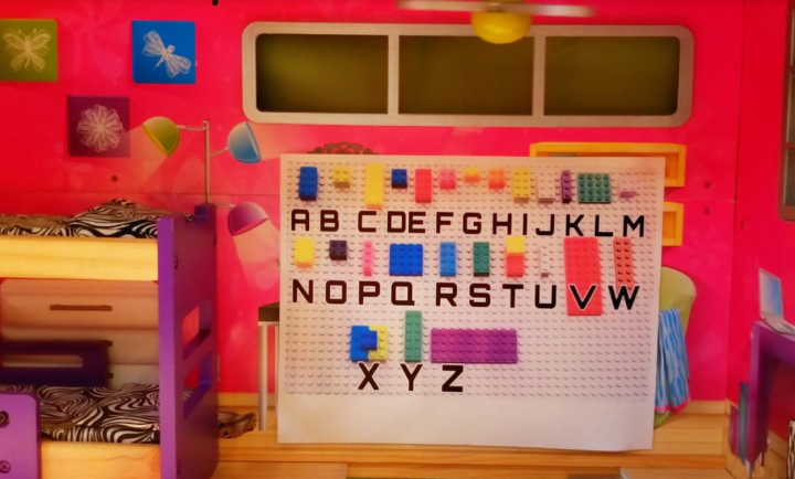 DIY escape room shows a alphabet code in a dollhouse
