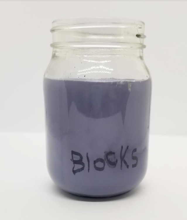 escape puzzles shows a jar with purple liquid and the word blocks written in the bottom