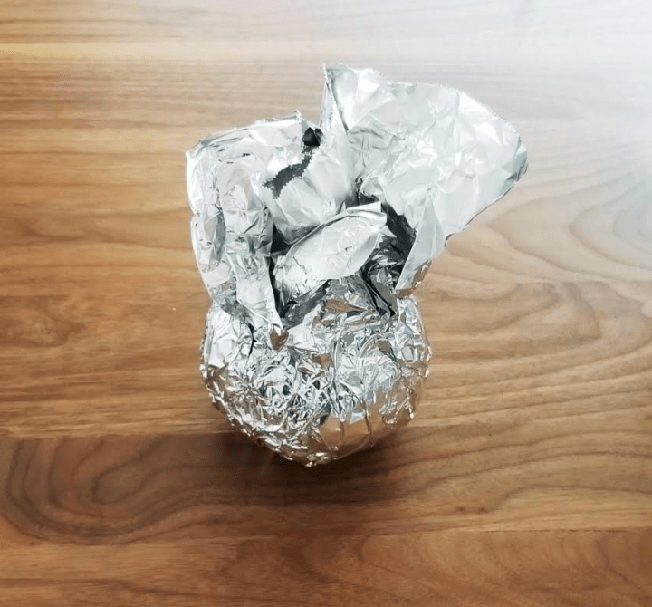 paper mache art shows a container covered in aluminum foil