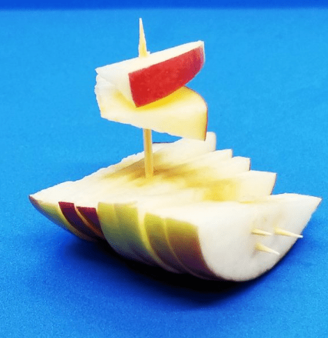fall stem activity shows a boat made from apple pieces.