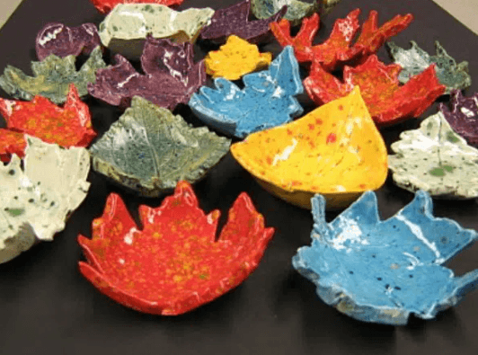 Leaf bowl craft shows a bunch of colorful leaf bowls.