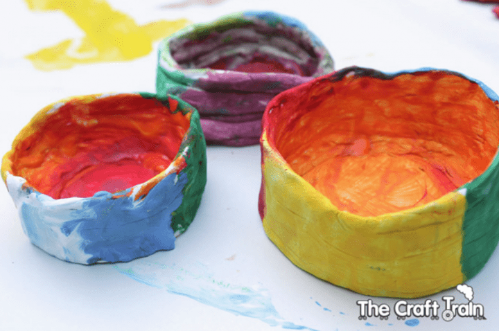 clay coil pot shows three colorful coil pots.