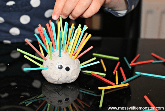 easy clay animals shows a hedgehog craft with straws as spikes.