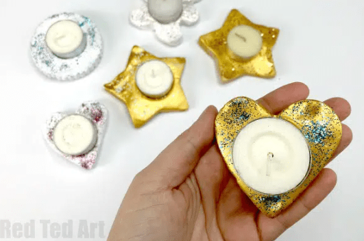 easy clay craft shows a heart clay candle holder.