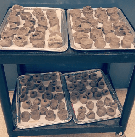 clay crafts and activities shows a collection of mini volcanoes made from clay.