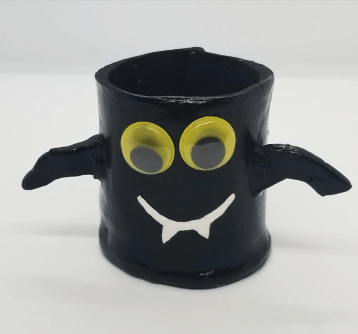 DIY halloween clay pots shows a bat pot.