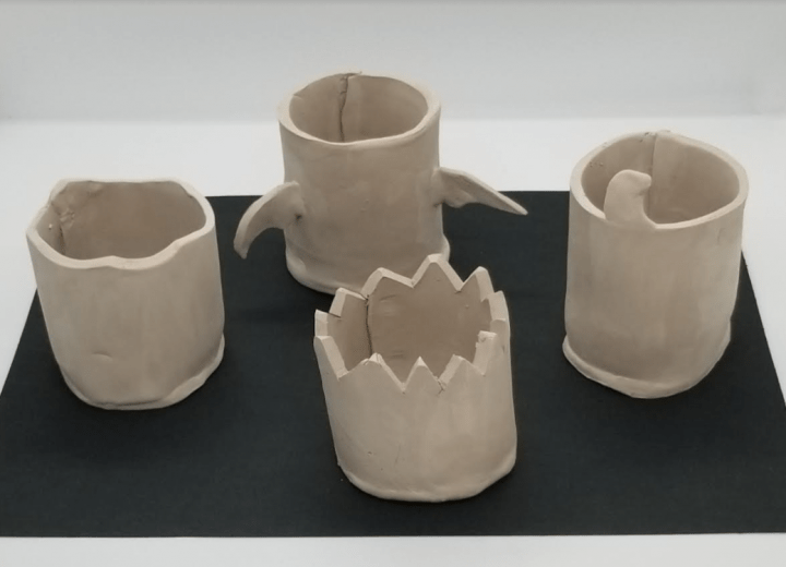 diy halloween clay pot shows 4 clay pots that are dry.