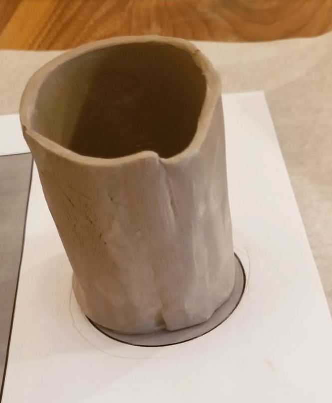 DIY clay crafts shows a clay cylinder.