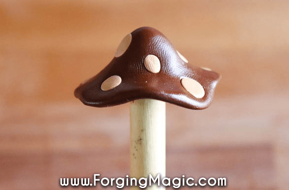 clay craft shows a small brown clay mushroom.