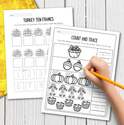 fall worksheet shows a child filling out and counting acorns and pumpkins.