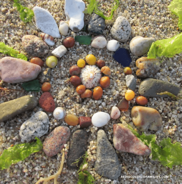 outdoor learning activities shows a spiral creation made from different colorful stones.