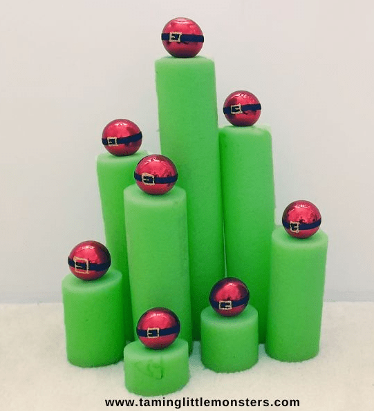 Holiday STEM shows green pool noodles with red bulbs on top.