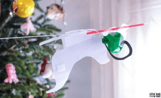 Christmas STEM activities shows a sleigh running across a string.