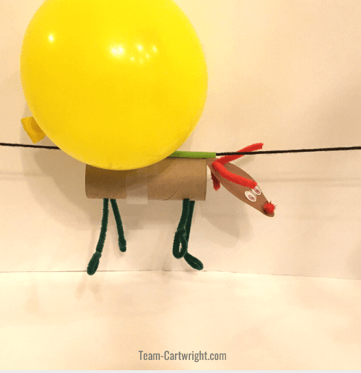 Christmas STEM for kids shows a reindeer on a string.