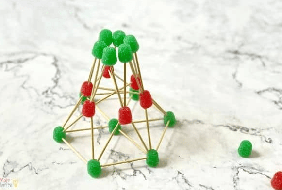 Christmas STEM activities shows a tree shape made from toothpicks and gumdrops.