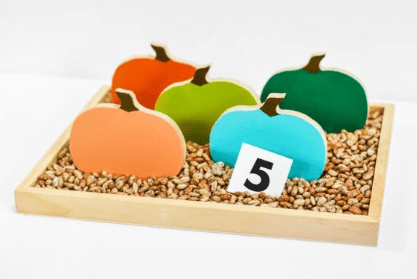 fall centers for kindergarten shows five pumpkins and the number 5.