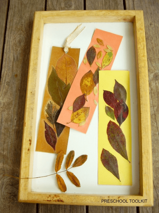 kindergarten learning activity shows three bookmarks made from paper and leaves.