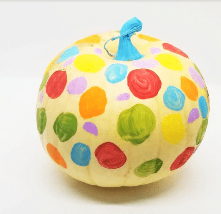 kindergarten learning centers shows a white pumpkin with colorful dots painted on.