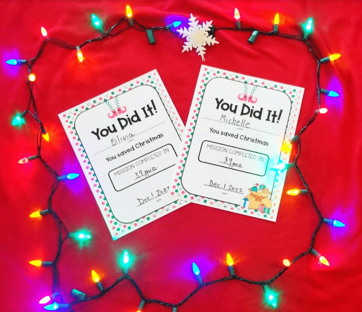 Escape room certificate shows two certificates on a red back ground with lights.