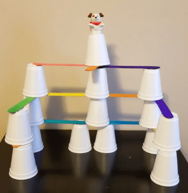 stem challenge shows a bunch of stacked cups and popsicle sticks.