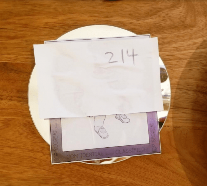 space escape room challenge shows two pieces of paper with the numbers 214 in the top corner.