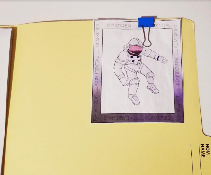 escape room printable shows a picture of an astronaut attached to a file.