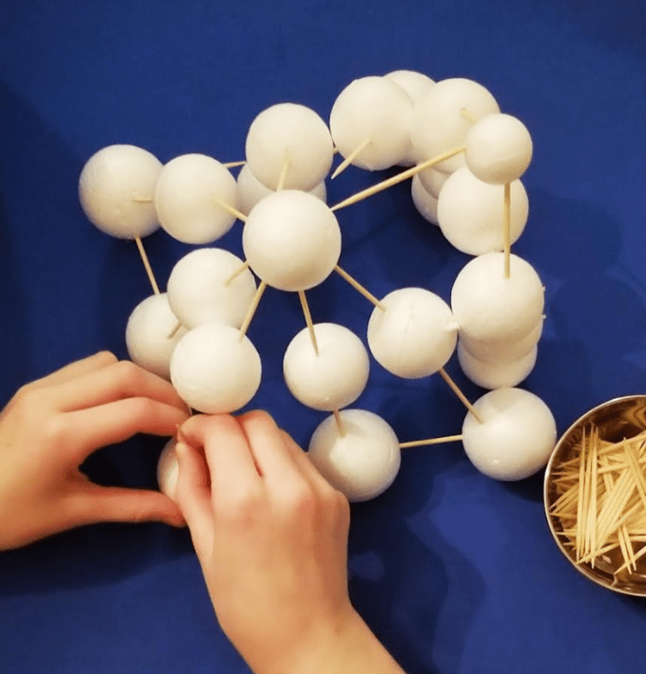 winter stem activity shows a child creating with Styrofoam balls and toothpicks.